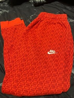 Men Nike Red All-Over Logo Joggers